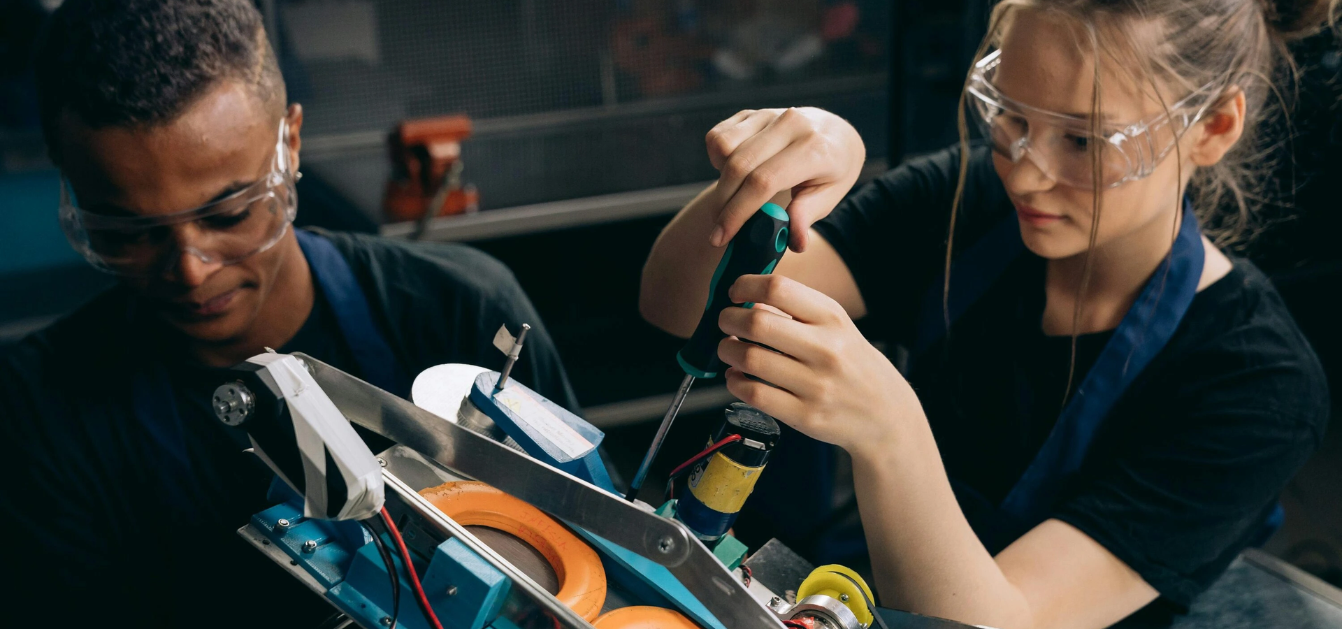 Technicians assembling equipment in a workshop